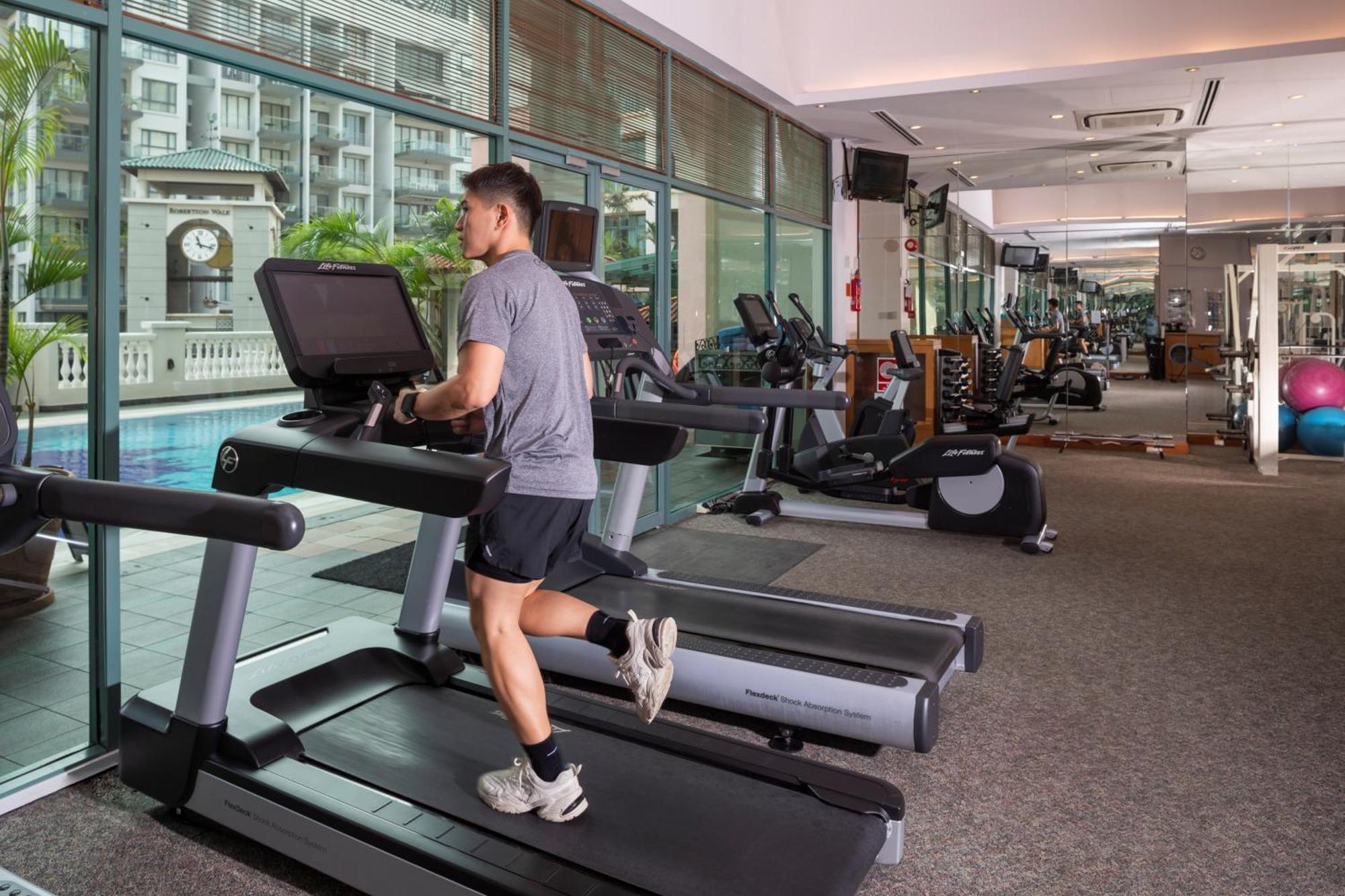 Fraser Place Robertson Walk Singapore Exteriör bild A man exercising on a treadmill